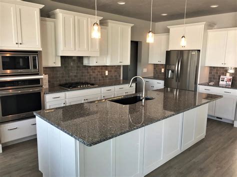 white kitchen cabinets with steel gray granite|white cabinet granite colors.